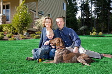 Happy family uses Stu's Professional Lawn Care Service